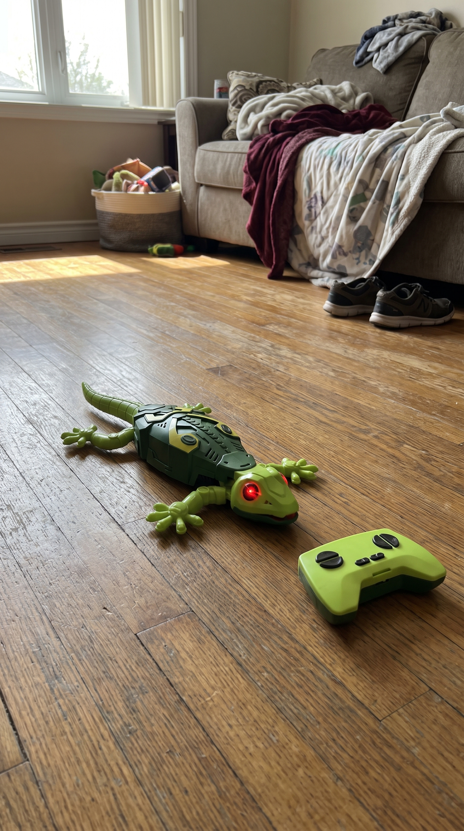 GeckoZoom with its remote control on the floor