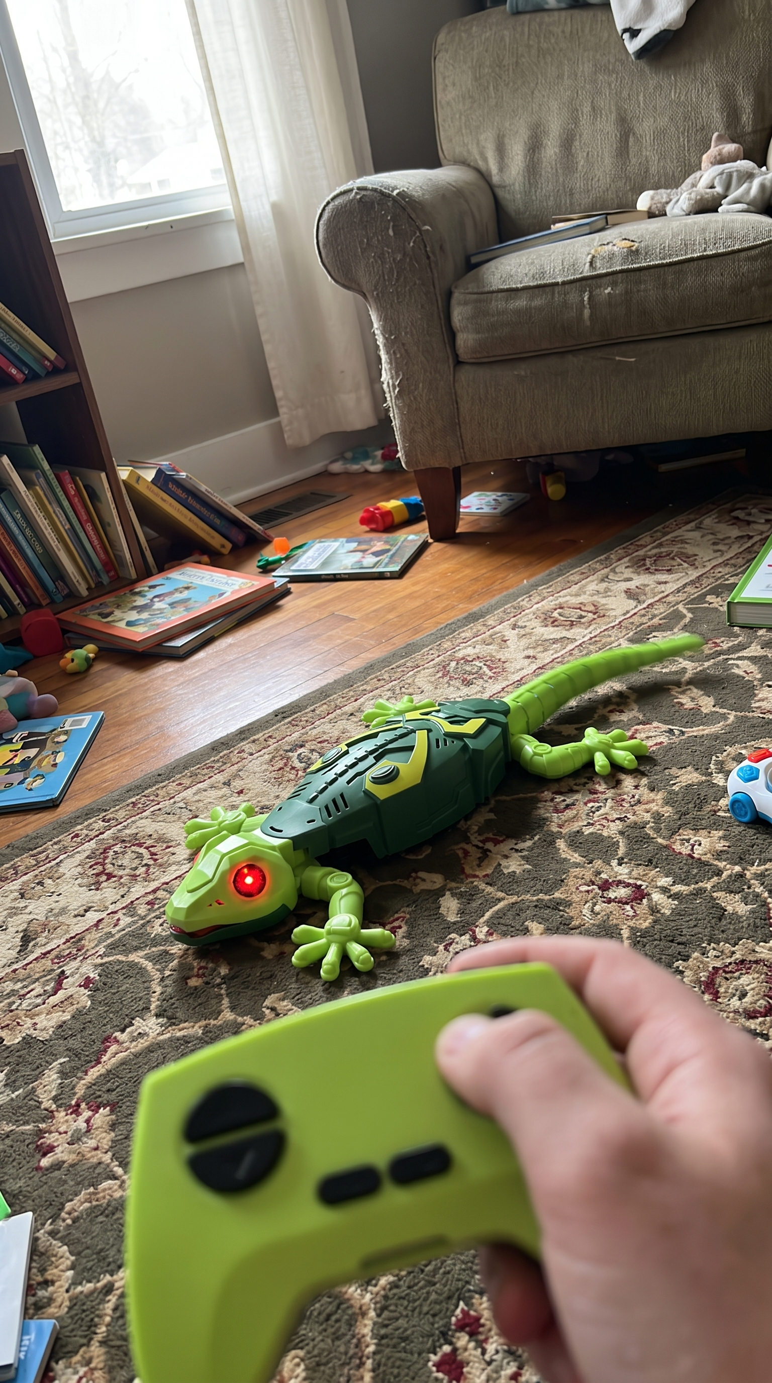 GeckoZoom on the living room floor next to a cat